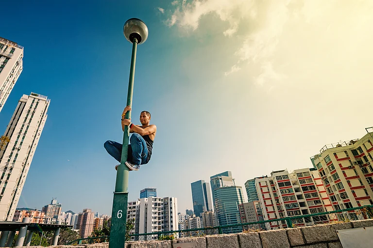 Parkour with Hong Kong skyline in the background - pio3/Shutterstock
